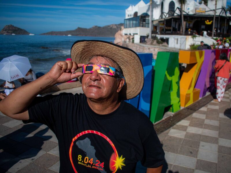 MAZATLAN, MEXICO - APRIL 08: A person watches the total solar eclipse at the beach on April 8, 2024 in Mazatlán, Mexico. Millions of people have flocked to areas across North America that are in the path of totality in order to experience a total solar eclipse. During the event, the moon will pass in between the sun and the Earth, appearing to block the sun. (Photo by Miguel Martínez Corona/ObturadorMX/Getty Images)
