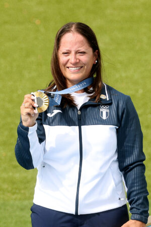 CHATEAUROUX, FRANCE - JULY 31: Gold medalist Adriana Ruano Oliva of Team Guatemala celebrates on the podium at the Shooting Trap Women’s medal ceremony on day five of the Olympic Games Paris 2024 at Chateauroux Shooting Centre on July 31, 2024 in Chateauroux, France. (Photo by Charles McQuillan/Getty Images)