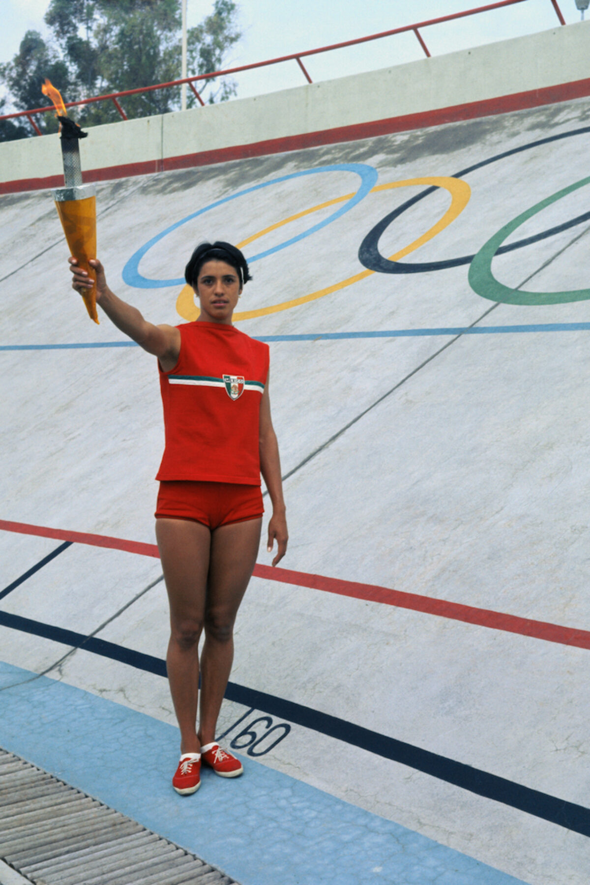 Enriqueta Basilio Waving on Olympic Grounds