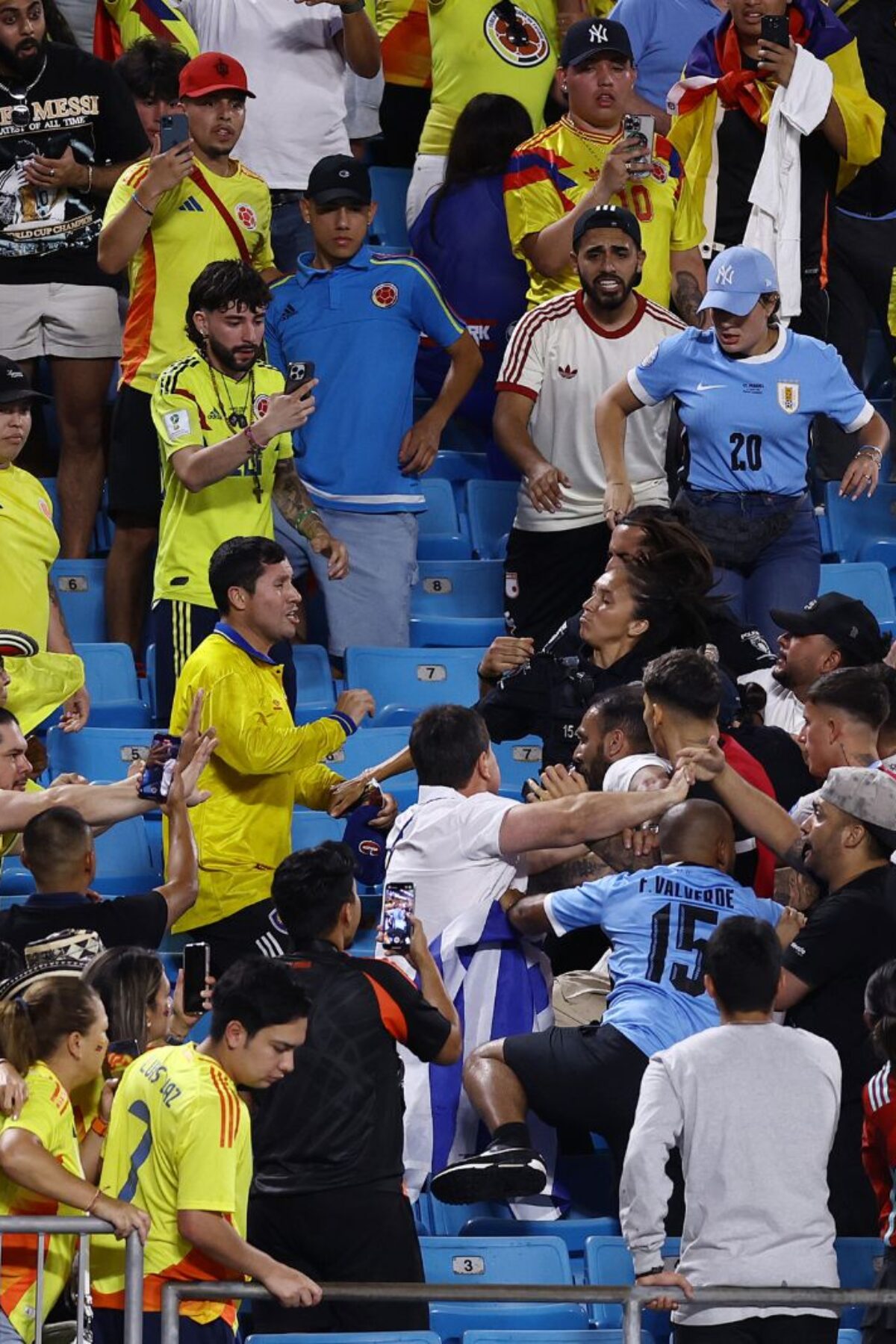 CHARLOTTE, NORTH CAROLINA - JULY 10: Fans of Colombia fight with fans and players of Uruguay after the CONMEBOL Copa America 2024 semifinal match between Uruguay and Colombia at Bank of America Stadium on July 10, 2024 in Charlotte, North Carolina. (Photo by Tim Nwachukwu/Getty Images)