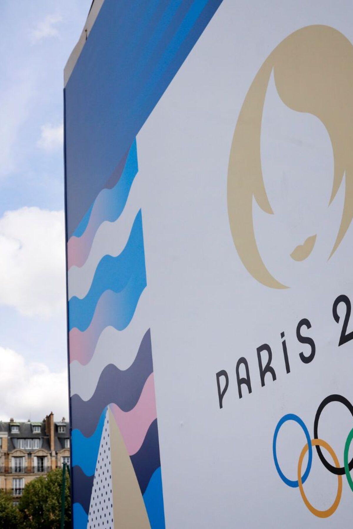 PARIS, FRANCE - JUNE 17: The Paris 2024 logo is displayed near the Eiffel Tower before the start of the Paris 2024 Olympic and Paralympic Games on June 17, 2024 in Paris, France. The city is gearing up to host the XXXIII Olympic Summer Games, from 26 July to 11 August. (Photo by Chesnot/Getty Images)