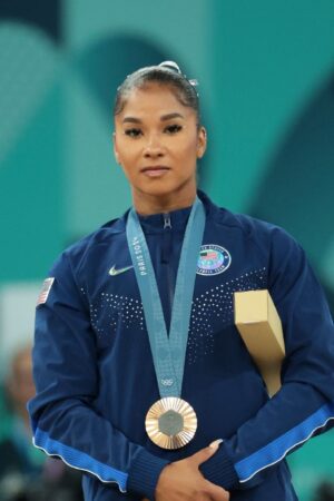 PARIS, FRANCE - AUGUST 05: Bronze medalist Jordan Chiles (R) of Team United States poses on the podium at the Artistic Gymnastics Women's Floor Exercise Medal Ceremony on day ten of the Olympic Games Paris 2024 at Bercy Arena on August 05, 2024 in Paris, France. (Photo by Jean Catuffe/Getty Images)