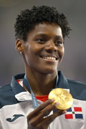 Paris , France - 9 August 2024; Marileidy Paulino of Team Dominican Republic celebrates with her women's 400m gold medal at the Stade de France during the 2024 Paris Summer Olympic Games in Paris, France. (Photo By Brendan Moran/Sportsfile via Getty Images)