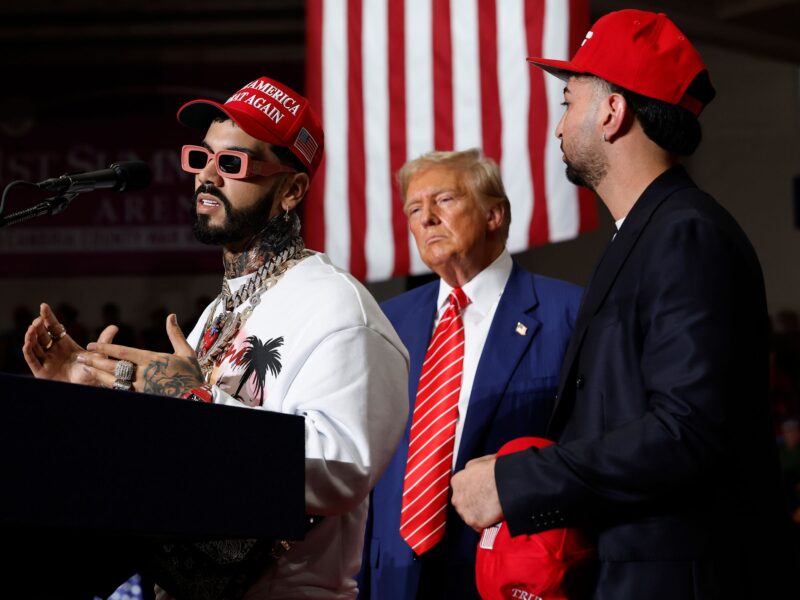 JOHNSTOWN, PENNSYLVANIA - AUGUST 30: Puerto Rican rapper Anuel AA (L) joins Republican presidential nominee, former U.S. President Donald Trump during a campaign rally in the 1st Summit Arena at the Cambria County War Memorial on August 30, 2024 in Johnstown, Pennsylvania. Promising to cut energy bills in half, conduct the largest deportation operation in history and put a 200% tariff on foreign made automobiles, Trump rallied his supporters in the all-important battleground state of Pennsylvania. (Photo by Chip Somodevilla/Getty Images)