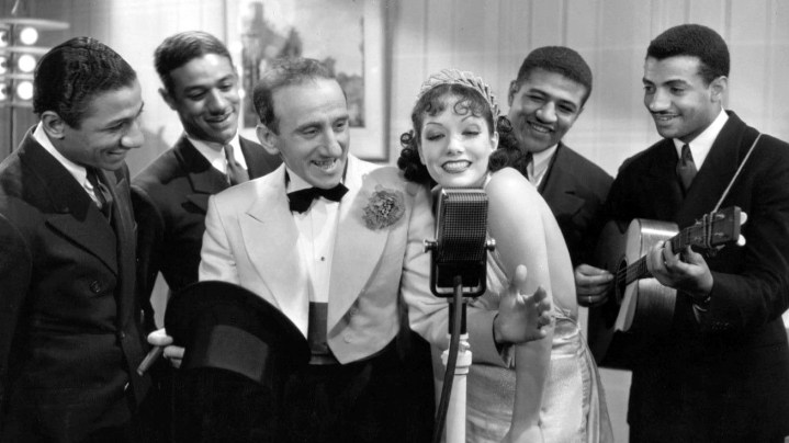 Photo of Jimmy Durante, Lupe Vélez and the Mills Brothers from the 1934 film ''Strictly Dynamite''. This work is in the public domain.