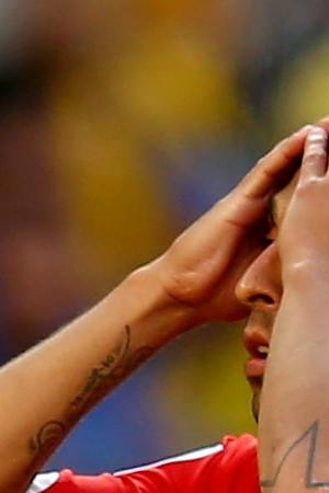 Gonzalo Jara of Chile reacts after being defeated by Brazil in a penalty shootout during the 2014 FIFA World Cup Brazil round of 16 match between Brazil and Chile at Estadio Mineirao on June 28, 2014 in Belo Horizonte, Brazil. Photo by Ronald Martinez/Getty Images