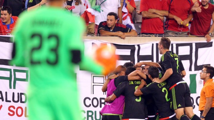 Jul 19, 2015; East Rutherford, NJ, USA; Mexico midfielder Andres Guardado (18) celebrates with teammates after kicking a penalty kick to score a goal against Costa Rica goalkeeper Esteban Alvarado (23) during stoppage time of the overtime period of a CONCACAF Gold Cup quarterfinal match at MetLife Stadium. Mexico won 1-0 in overtime. Mandatory Credit: Brad Penner-USA TODAY Sports ORG XMIT: USATSI-230456 ORIG FILE ID:  20150719_ads_ae5_226.JPG