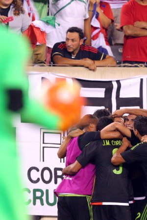 Jul 19, 2015; East Rutherford, NJ, USA; Mexico midfielder Andres Guardado (18) celebrates with teammates after kicking a penalty kick to score a goal against Costa Rica goalkeeper Esteban Alvarado (23) during stoppage time of the overtime period of a CONCACAF Gold Cup quarterfinal match at MetLife Stadium. Mexico won 1-0 in overtime. Mandatory Credit: Brad Penner-USA TODAY Sports ORG XMIT: USATSI-230456 ORIG FILE ID:  20150719_ads_ae5_226.JPG