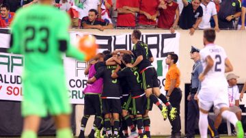 Jul 19, 2015; East Rutherford, NJ, USA; Mexico midfielder Andres Guardado (18) celebrates with teammates after kicking a penalty kick to score a goal against Costa Rica goalkeeper Esteban Alvarado (23) during stoppage time of the overtime period of a CONCACAF Gold Cup quarterfinal match at MetLife Stadium. Mexico won 1-0 in overtime. Mandatory Credit: Brad Penner-USA TODAY Sports ORG XMIT: USATSI-230456 ORIG FILE ID: 20150719_ads_ae5_226.JPG