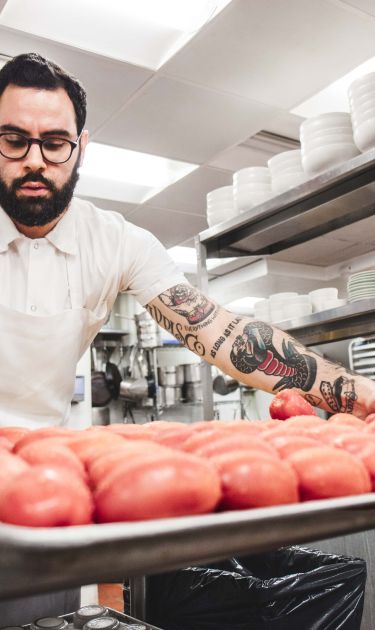 After going to the local farmers market, Chef Luis Herrera preps for Cosme’s daily staff lunch. Photo by Itzel Alejandra Martinez for Remezcla