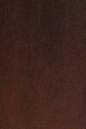 American labor leader Cesar Chavez (1927 - 1993) smiles while standing in front of a wooden wall, 1950s. Photo by Hulton Archive/Getty Images