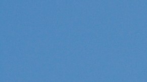 Mexican Flag, National Banner of Mexico Waving Against Blue Sky