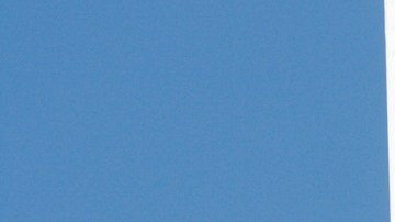 Mexican Flag, National Banner of Mexico Waving Against Blue Sky