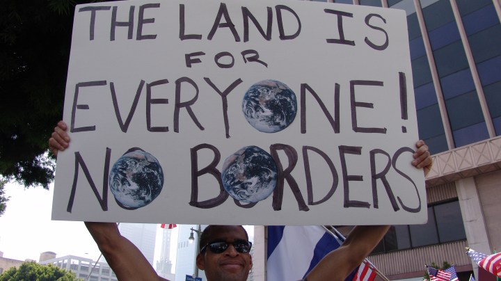 Creative Commons "Immigrant rights march for amnesty in downtown Los Angeles, California on May Day, 2006” by Jonathan McIntosh is licensed under CC BY 2.0