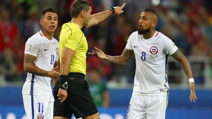 Eduardo Vargas of Chile and Arturo Vidal of Chile appeal to referee Damir Skomina after Chile had a goal disallowed during the  FIFA Confederations Cup Russia 2017 Group B match between Cameroon and Chile at Spartak Stadium. Photo by Dean Mouhtaropoulos/Getty Images