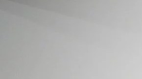 A member of the gallery team poses with "Autorretrato" by artist Frida Kahlo at the Ordovas gallery in London, England.   Photo by Leon Neal/Getty Images News