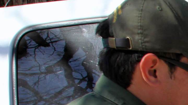 Border Patrol agents take a family from El Salvador into custody at the city cemetery for illegally entering the United States by crossing the Rio Grande River. The family, from San Vicente, was fleeing gang violence, which is rampant in El Salvador. Photo b Vichinterlang /Editorial RF