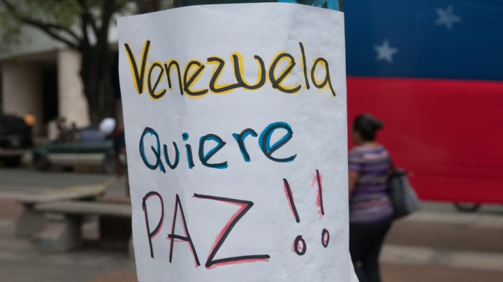 Creative Commons "Banner at demonstrations and protests against Chavismo and Nicolas Maduro government” by The Photographer is licensed under CC BY 1.0