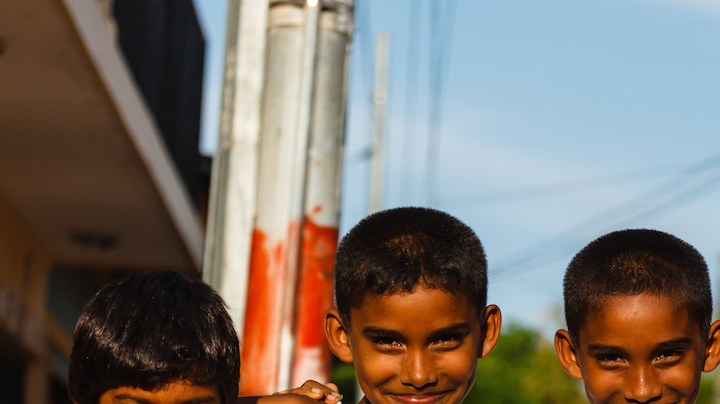 Group of young boys playing  street soccer pose for photo.  Soccer is one of the most popular national sports of Nicaragua and the world. Photo by Pniesen/ iStock Editorial / Getty Images Plus