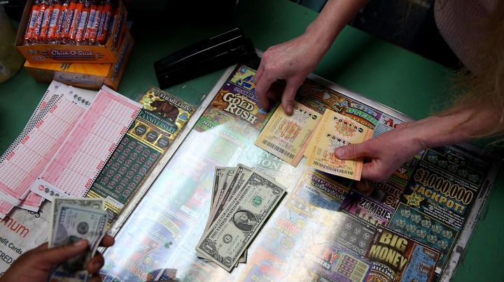 A customer buys Powerball tickets at Kavanagh Liquors in San Lorenzo, California. Photo by Justin Sullivan/Getty Images News
