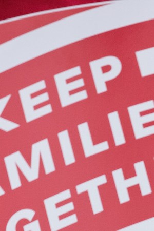 Mexican immigrant Nieves Ojendiz holds her 4-year old daughter Jane as she attends an immigration reform rally with members and supporters of the New York Immigration Coalition. Photo by rew Angerer/Getty Images News