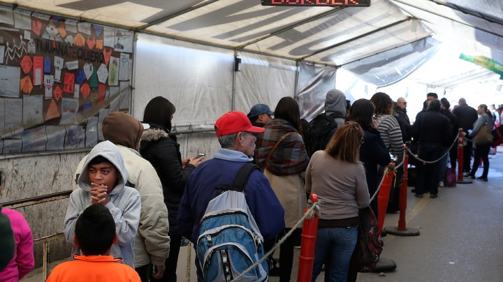 People wait in line to enter the United States at the San Ysidro Port of Entry on January 27, 2017 in Tijuana, Mexico. Photo by Justin Sullivan/Getty Images News