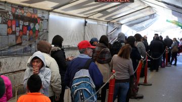 People wait in line to enter the United States at the San Ysidro Port of Entry on January 27, 2017 in Tijuana, Mexico. Photo by Justin Sullivan/Getty Images News