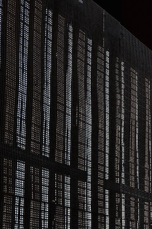 A man stands next to the U.S.-Mexico border fence at Friends of Friendship Park on February 4, 2017 in San Ysidro, California. Photo by Justin Sullivan/Getty Images  News