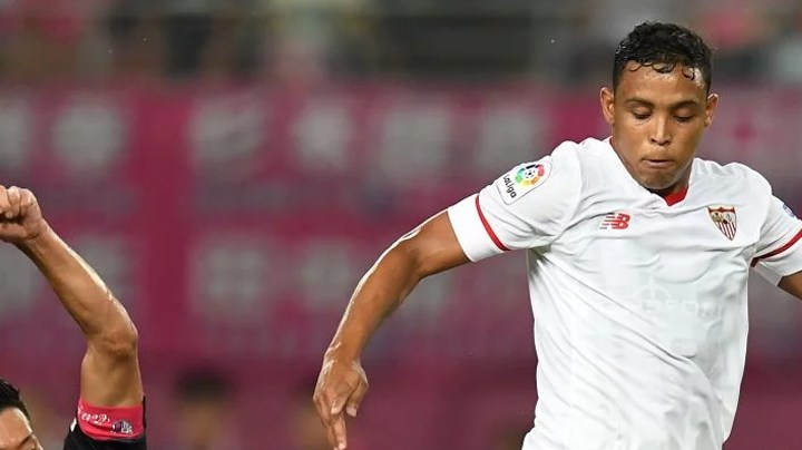 Luis Muriel of Sevilla FC is tackled by Hotaru Yamaguchi of Cerezo Osaka during a preseason friendly. Photo by Atsushi Tomura/Getty Images