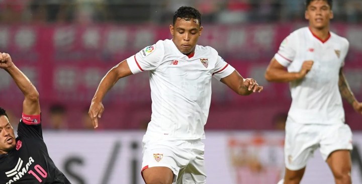 Luis Muriel of Sevilla FC is tackled by Hotaru Yamaguchi of Cerezo Osaka during a preseason friendly. Photo by Atsushi Tomura/Getty Images