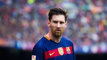 Lionel Messi looks on during a La Liga match between FC Barcelona and RCD Espanyol. Photo by Alex Caparros/Getty Images