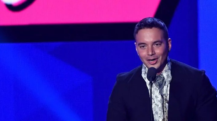 J Balvin accepts an award on stage during Univision's "Premios Juventud."   Photo by Rodrigo Varela/Getty Images Entertainment