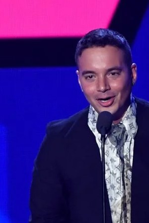 J Balvin accepts an award on stage during Univision's "Premios Juventud."   Photo by Rodrigo Varela/Getty Images Entertainment