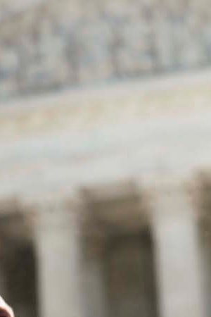 Texas Attorney General Ken Paxton speaks to reporters at a news conference outside the Supreme Court on Capitol Hill. Photo by Gabriella Demczuk/Getty Images News