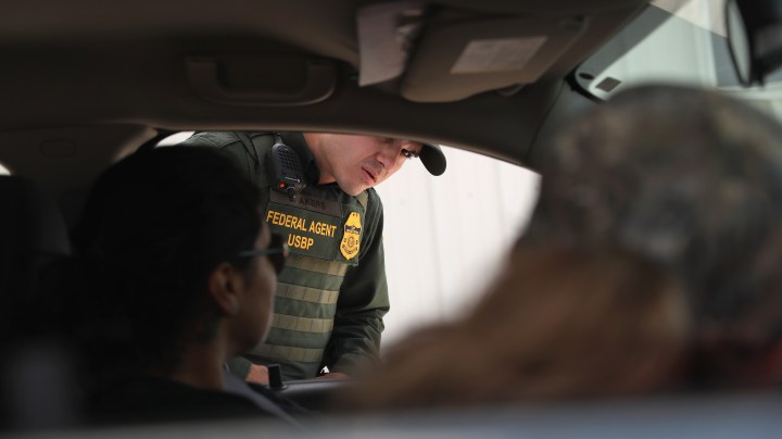A new U.S. Border Patrol agent checks a vehicle during a training scenario at the Border Patrol Academy on August 2, 2017 in Artesia, New Mexico. Photo by John Moore/Getty Images News