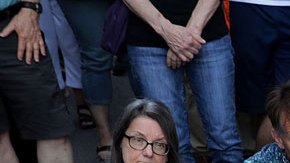 Hundreds of people gather for a vigil on the spot where 32-year-old Heather Heyer was killed when a car plowed into a crowd of people protesting against the white supremacist Unite the Right rally August 13, 2017 in Charlottesville, Virginia. Photo by Chip Somodevilla/Getty Image News