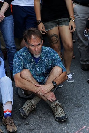 Hundreds of people gather for a vigil on the spot where 32-year-old Heather Heyer was killed when a car plowed into a crowd of people protesting against the white supremacist Unite the Right rally August 13, 2017 in Charlottesville, Virginia. Photo by Chip Somodevilla/Getty Image News