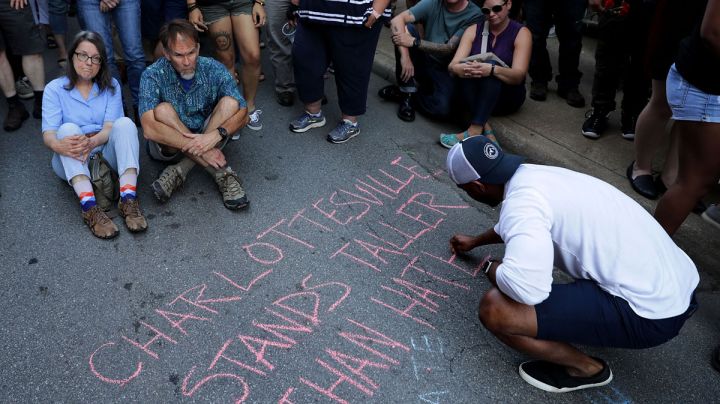 Hundreds of people gather for a vigil on the spot where 32-year-old Heather Heyer was killed when a car plowed into a crowd of people protesting against the white supremacist Unite the Right rally August 13, 2017 in Charlottesville, Virginia. Photo by Chip Somodevilla/Getty Image News