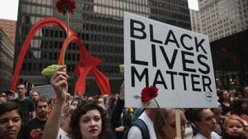 People gather downtown protest the alt-right movement and to mourn the victims of yesterdays rally in Charlottesville, Virginia on August 13, 2017 in Chicago, Illinois. Photo by Scott Olson/Getty Images News