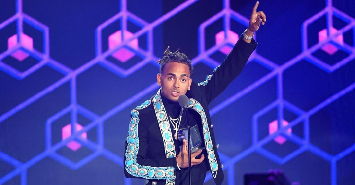 Ozuna accepts an award on stage at Univision's 'Premios Juventud' 2017. Photo by Rodrigo Varela / Stringer / Getty Images North America