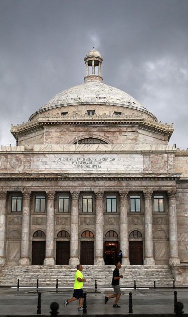 The Puerto Rican Capitol building is seen as the island's residents deal with the government's $72 billion debt on July 1, 2015 in San Juan, Puerto Rico. Photo by Joe Raedle/Getty Images News