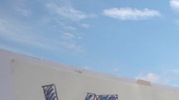 People hold signs over the 110 freeway as thousands of immigrants and supporters join the Defend DACA March to oppose the President Trump order to end DACA on September 10, 2017 in Los Angeles, California. Photo by David McNew/Getty Images News