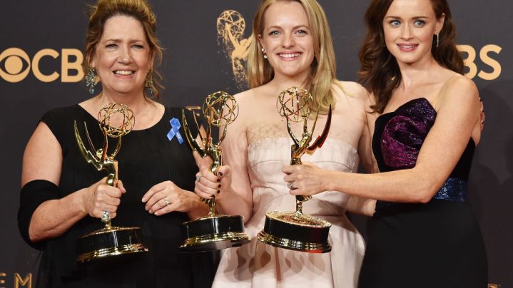 Actors Ann Dowd, winner of Outstanding Supporting Actress in a Drama Series for 'The Handmaid's Tale', Elisabeth Moss, winner of Outstanding Lead Actress in a Drama Series for 'The Handmaid's Tale' and Alexis Bledel pose in the press room during the 69th Annual Primetime Emmy Awards. Photo by Alberto E. Rodriguez/Getty Images