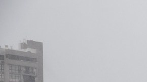 A resident looks out over the Miramar neighborhood after Hurricane Maria made landfall on September 20, 2017 in San Juan, Puerto Rico. Photo by Alex Wroblewski/Getty Images News