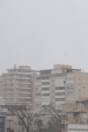 A resident looks out over the Miramar neighborhood after Hurricane Maria made landfall on September 20, 2017 in San Juan, Puerto Rico. Photo by Alex Wroblewski/Getty Images News