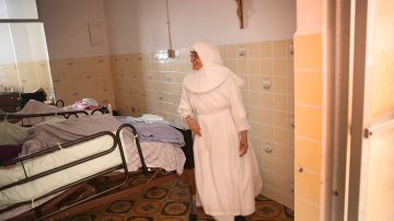 Sister Gloria Flores checks in on some frail patients at the Hermanitas de los Ancianos Desamparados facility Photo by Joe Raedle/Getty Images News