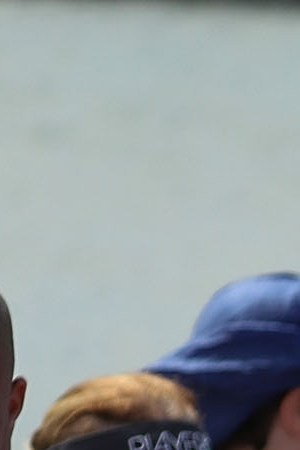 Gary Flores and Tabatha Flores stand in line with other people to get on a Royal Caribbean International, Adventure of the Seas, relief boat that is sailing to Ft. Lauderdale, Florida with evacuees that are fleeing after the island was hit by Hurricane Maria Photo by Joe Raedle/Getty Images News