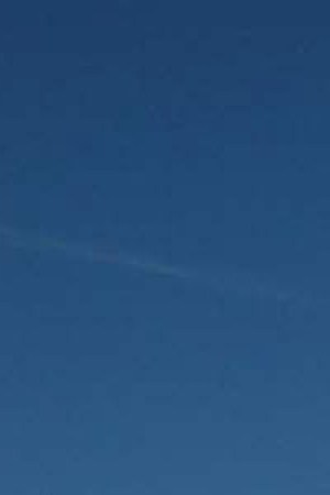 A man walks past a statue of Christopher Columbus that was vandalized with red paint at Union Station October 14, 2002 in Washington, D.C. Photo by Mark Wilson/Getty Images News