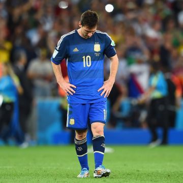 A dejected Lionel Messi reacts after being defeated by Germany 1-0 in extra time during the 2014 FIFA World Cup Brazil Final. Photo by Matthias Hangst/Getty Images