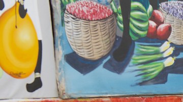 Unidentified man sells works of local artists at the street on November 08, 2012 in Santo Domingo, Dominican Republic.  Photo by Dmitry_Chulov/iStock Editorial / Getty Images Plus